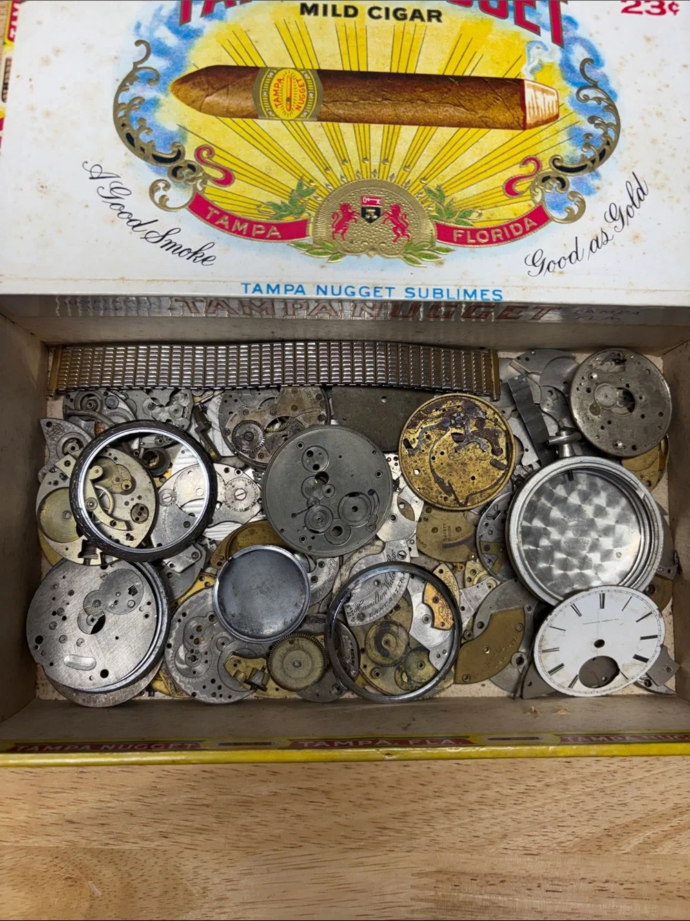 Vintage Tampa Nugget cigar box with old watch parts